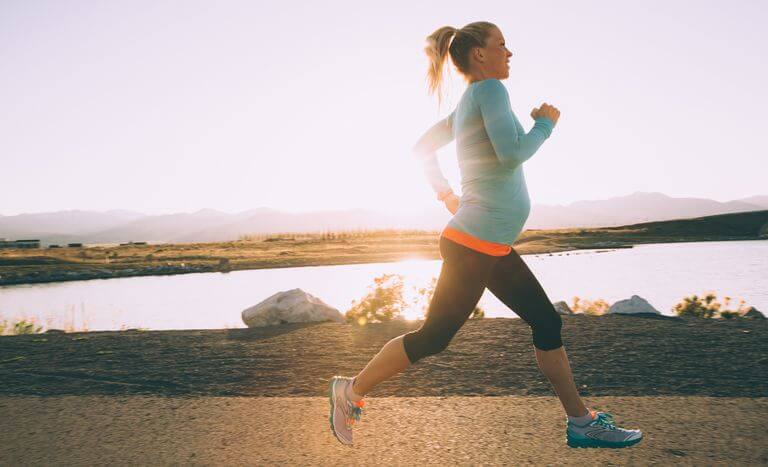 pregnant-woman-running-at-sunrise
